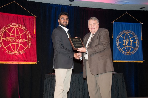 Left: EECS Ph.D. student Sumant Pathak, Right: Cliff Aggen, Chair of Student Paper Program 