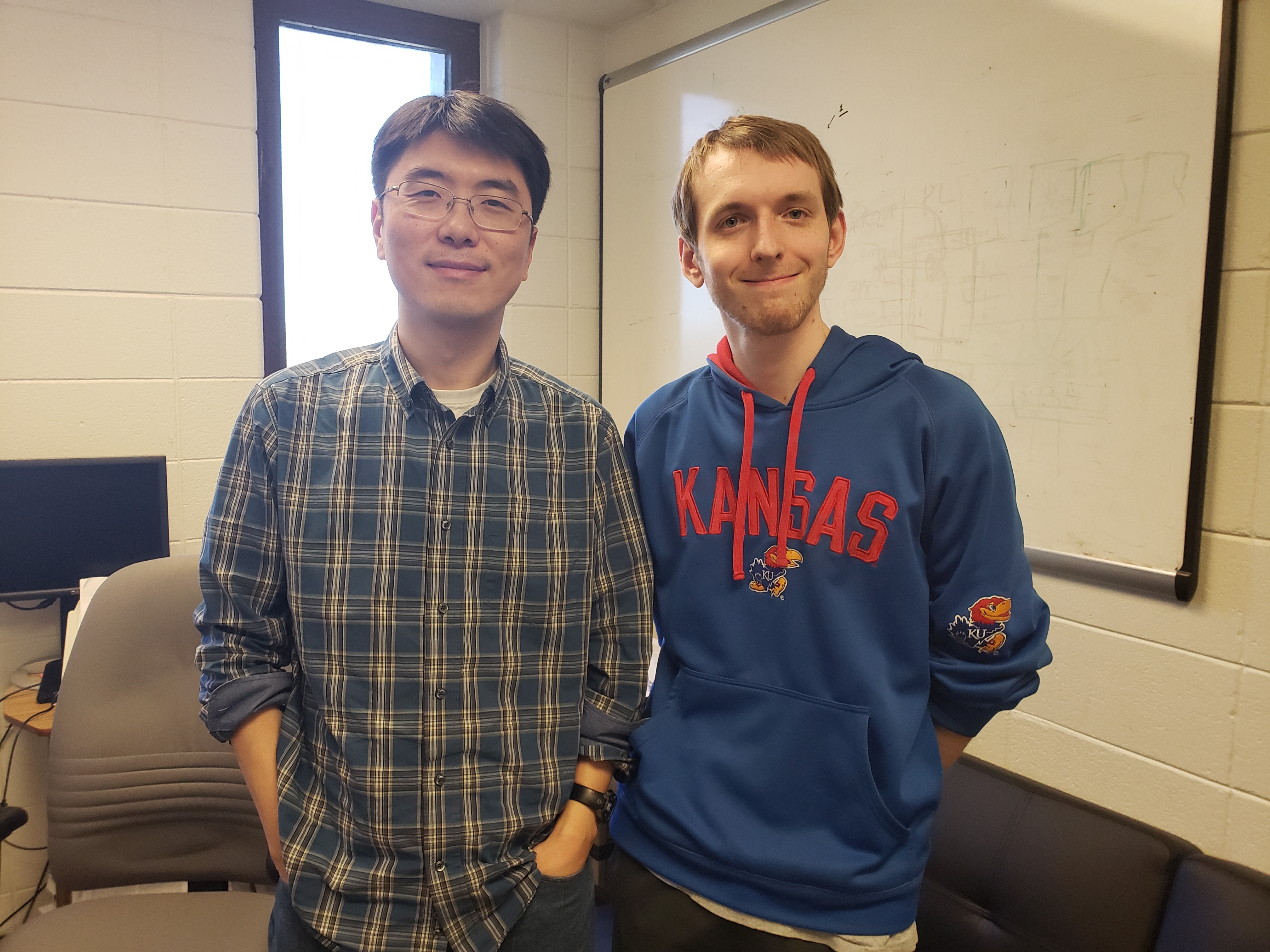EECS Assistant Professor Heechul Yun (left) and Ph.D. student Michael Bechtel (right)