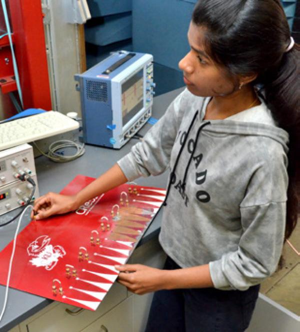 a student testing electrical connections