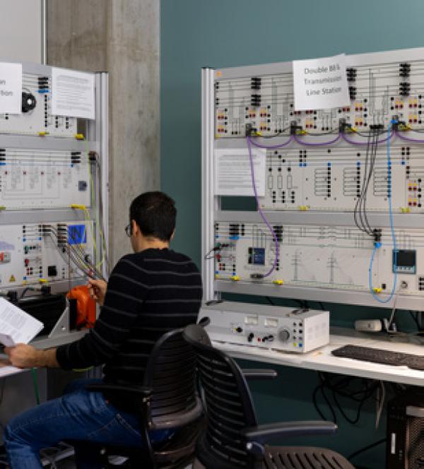 a student working in a room with lots of equipment