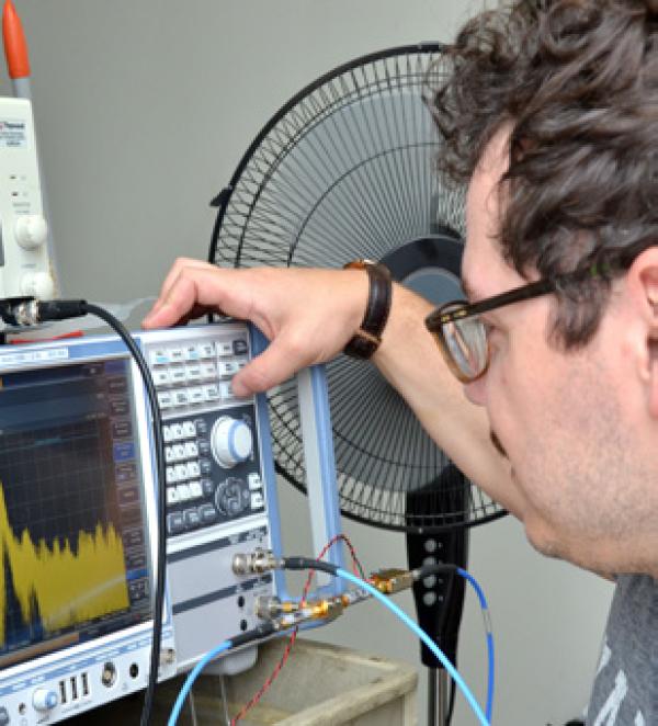 a researcher looks at a monitor